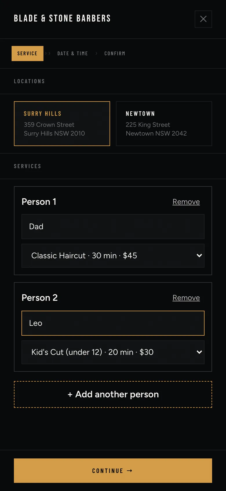 Group booking for Dad’s Classic Haircut and Leo’s Kid’s Cut, with an option to add another person.